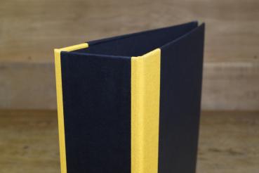 black folder with yellow linen edges
